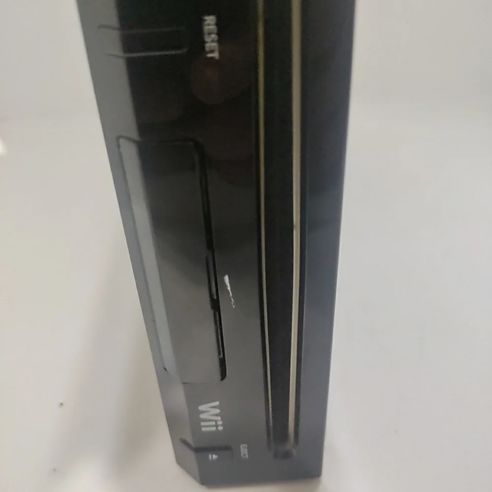 Nintendo Wii Black Console with AV cord, plug and bar used.. Tested the Nintendo